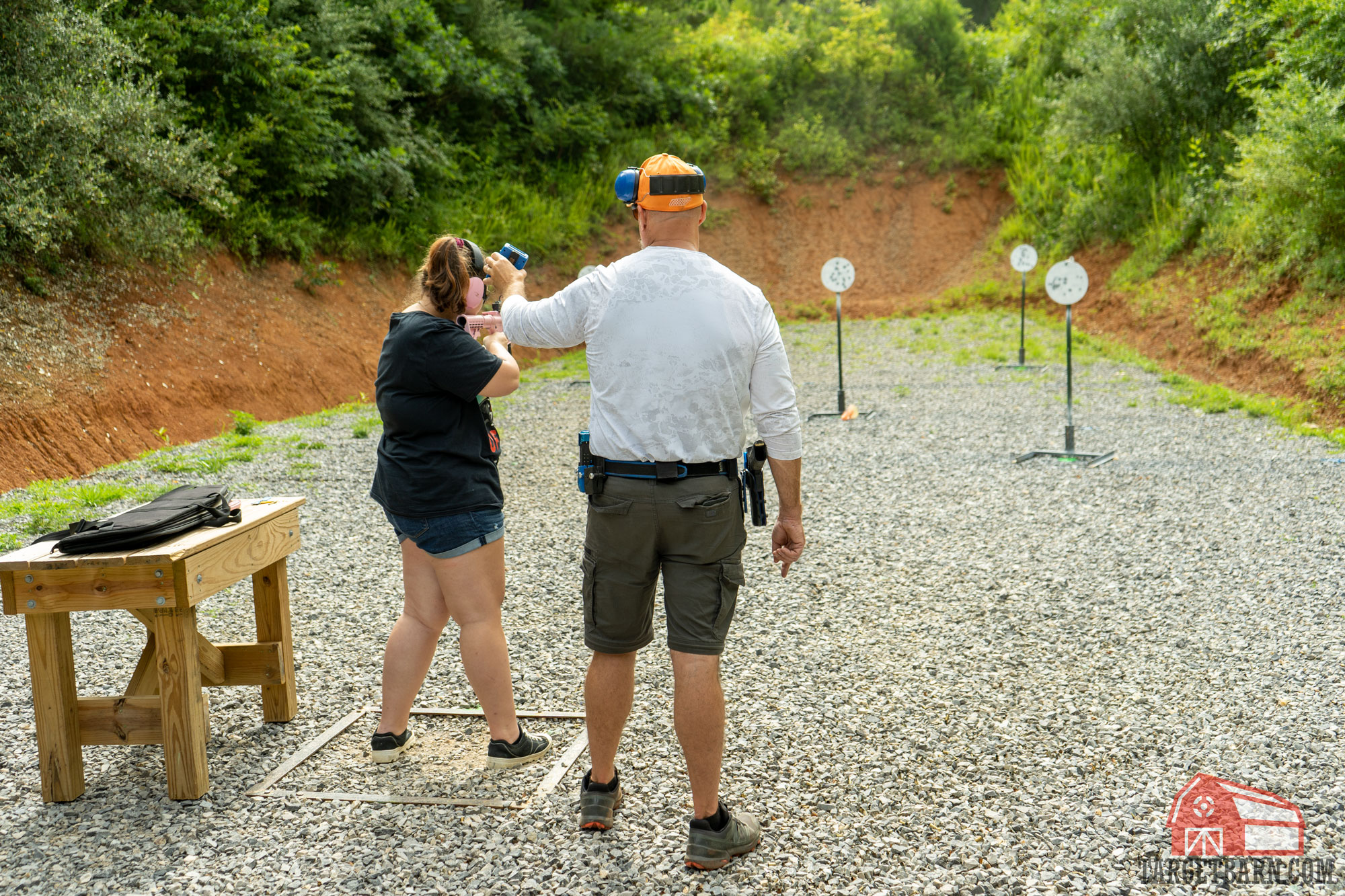 a girl shooting a steel challenge stage