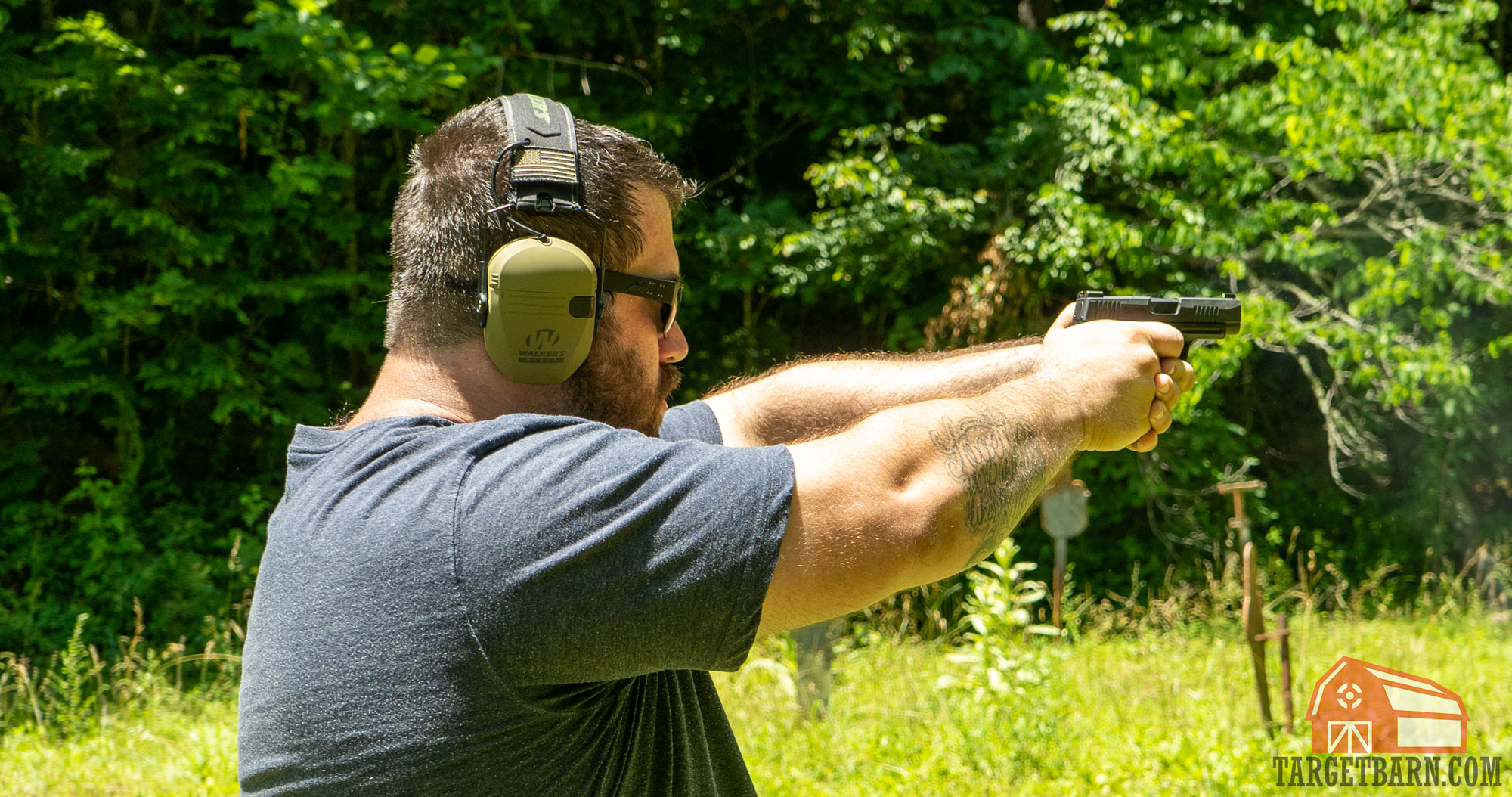 a man shooting a sig p365 xl subcompact pistol