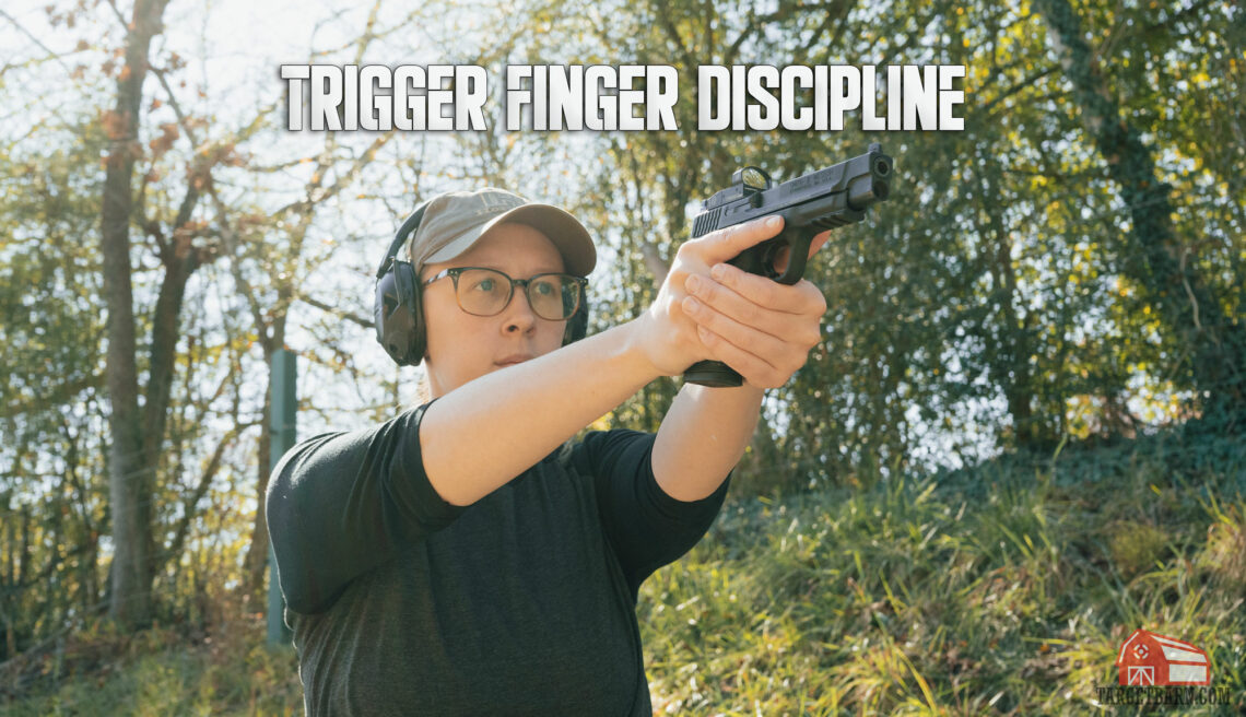 trigger discipline hero image showing the author holding a pistol with proper trigger discipline