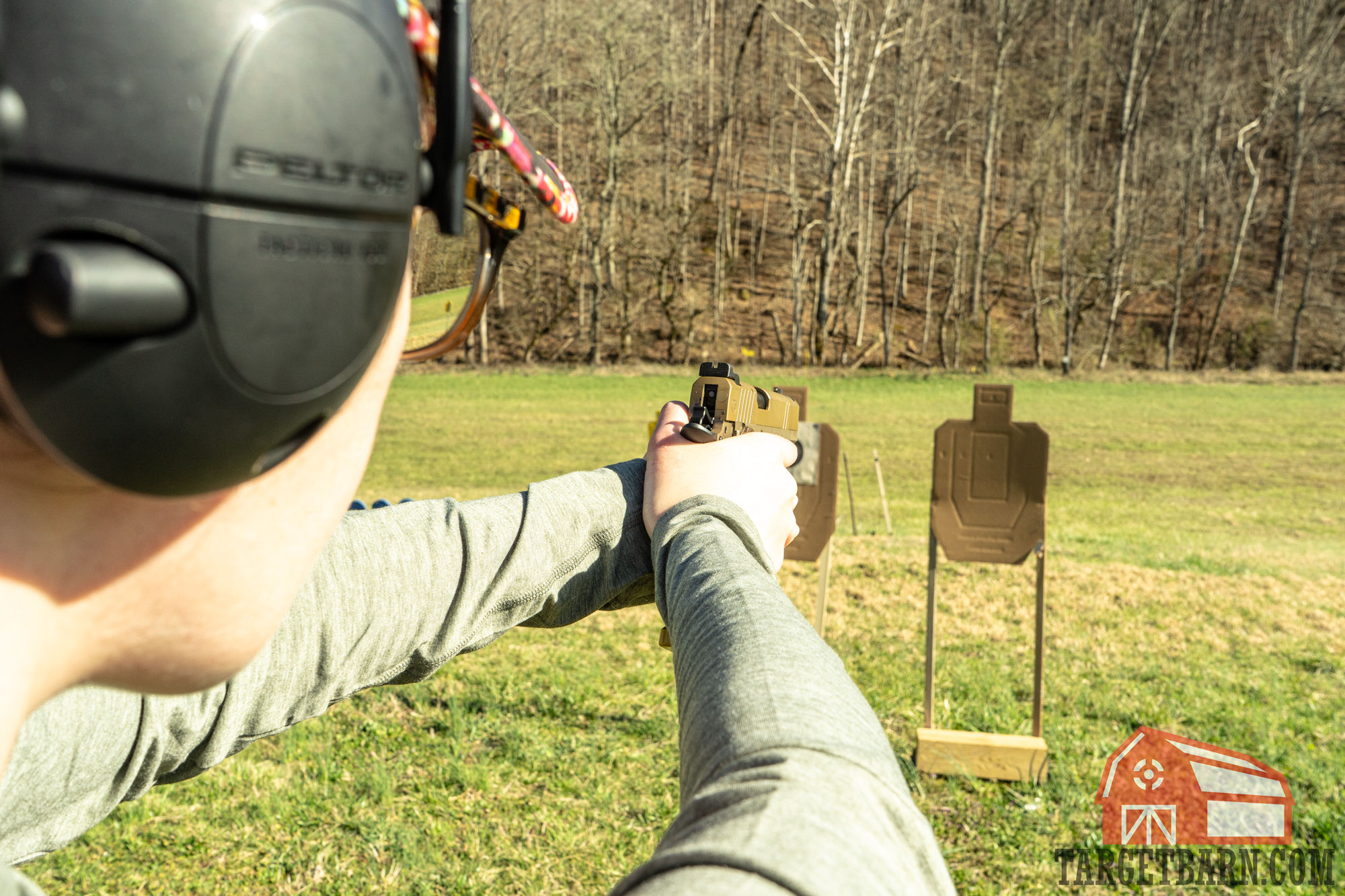 uspsa target the author shooting a pistol at a target barn uspsa target