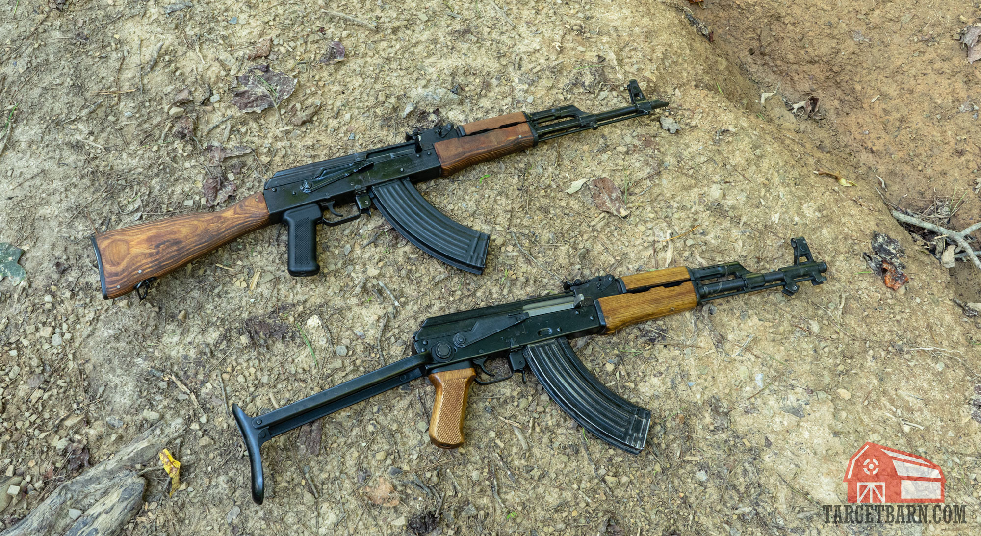 two ak-47 variants laying on the ground, showing the wasr10 and aks