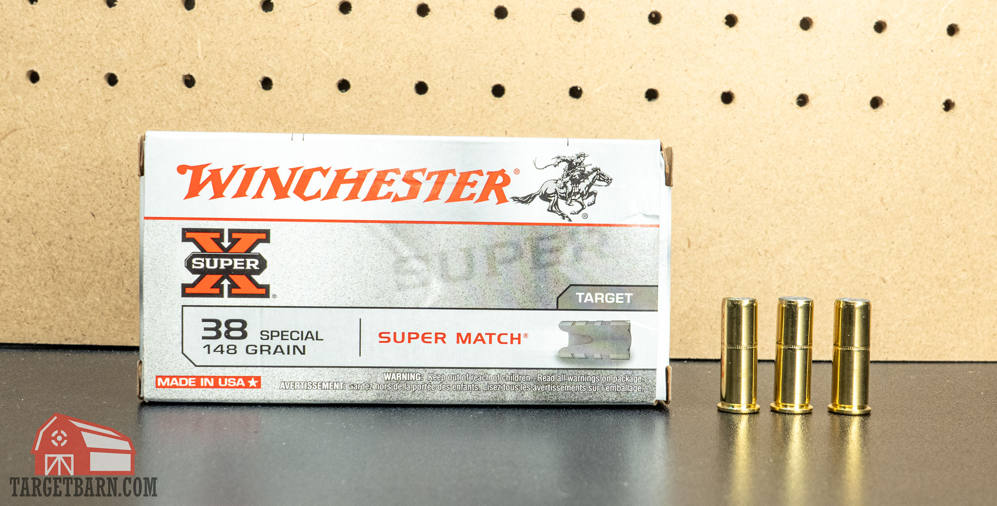 a box and three rounds of winchester .38 special 148gr. wadcutters